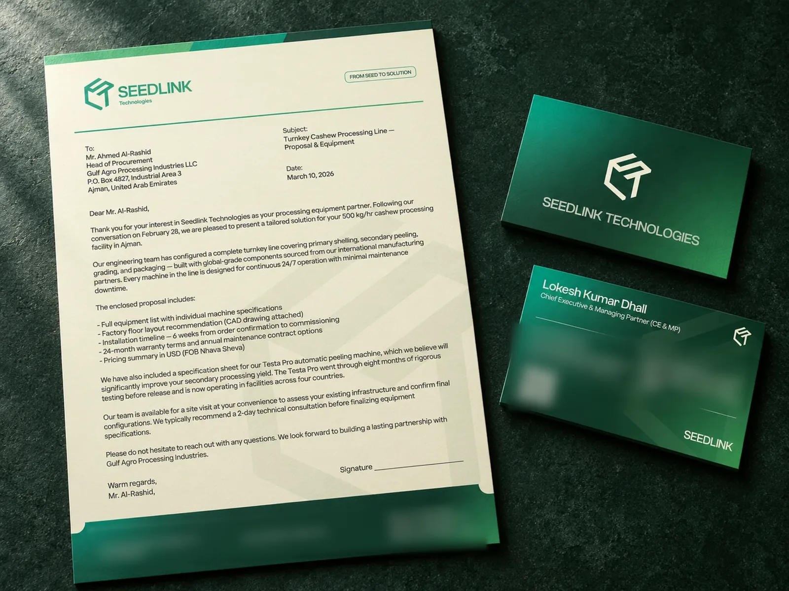 Seedlink Technologies stationery on dark green stone: a letterhead with the green cube logo and "From seed to solution", beside the front and back of a deep green business card